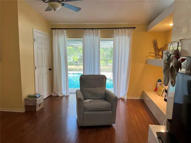 a living room with furniture and a window