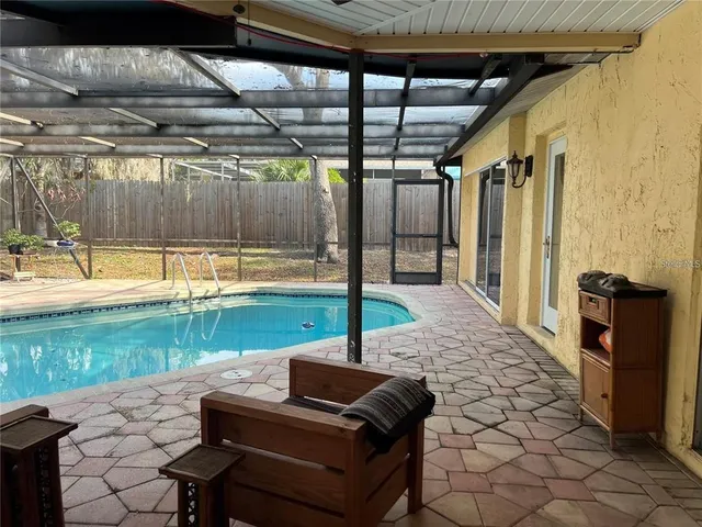a patio with yard table and chairs
