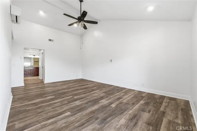a view of a livingroom with a hardwood floor and a ceiling fan