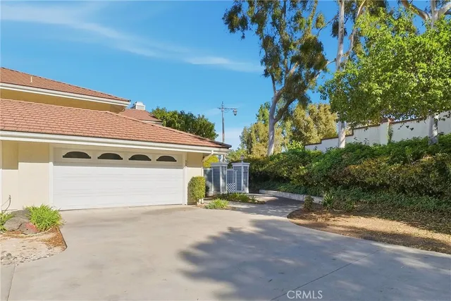 a view of a house with a yard and garage