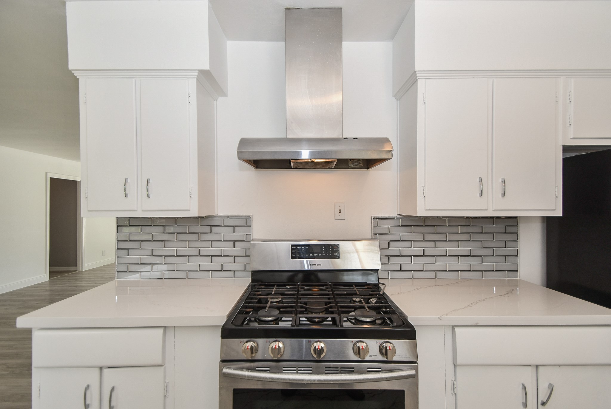 5330 Windswept Lane Houston, TX 77056 - Photo 7 of 20 a kitchen with white cabinets and appliances