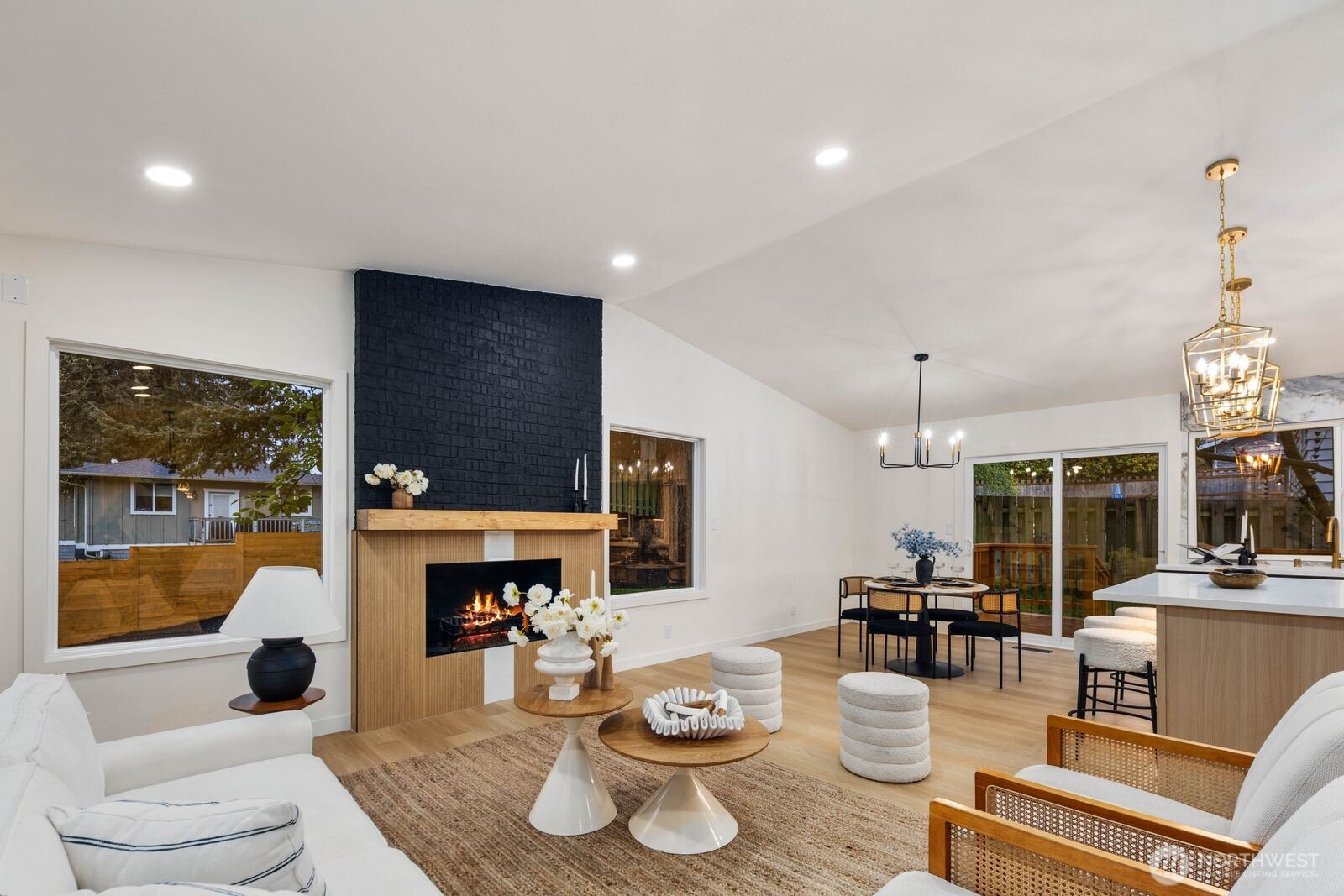 7211 182nd Street Southwest Edmonds, WA 98026 - Photo 13 of 40 a living room with furniture a fireplace and a large window