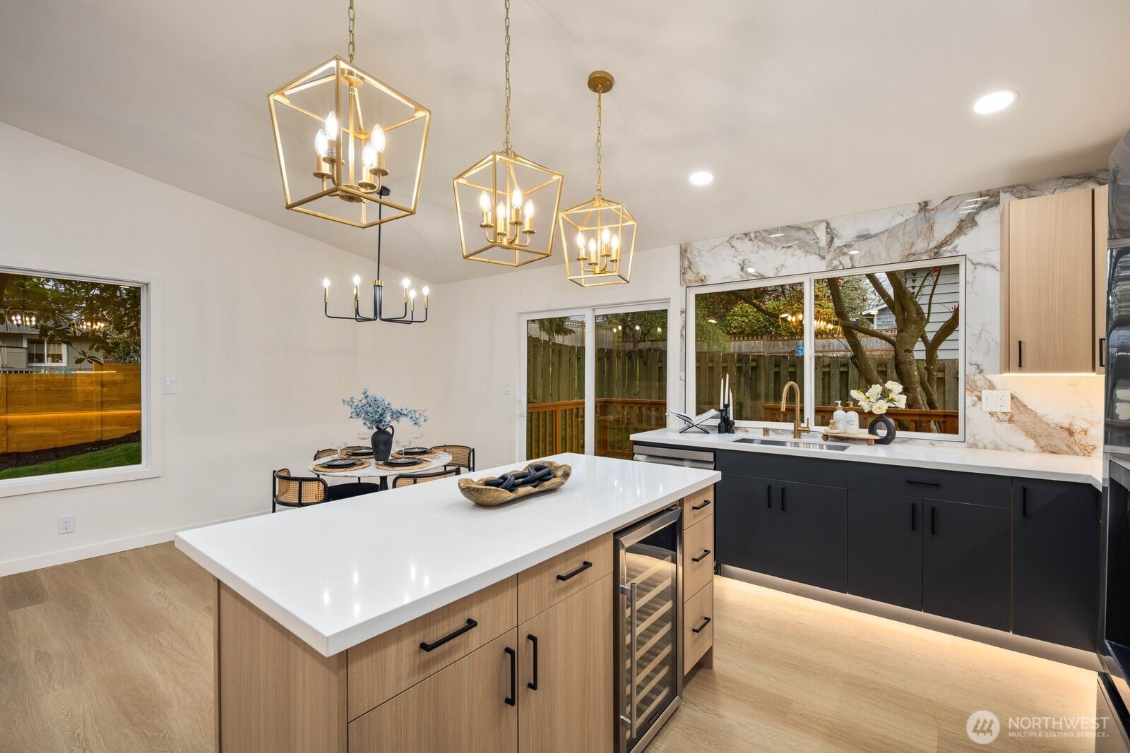 7211 182nd Street Southwest Edmonds, WA 98026 - Photo 17 of 40 a kitchen that has a lot of cabinets and wooden floor