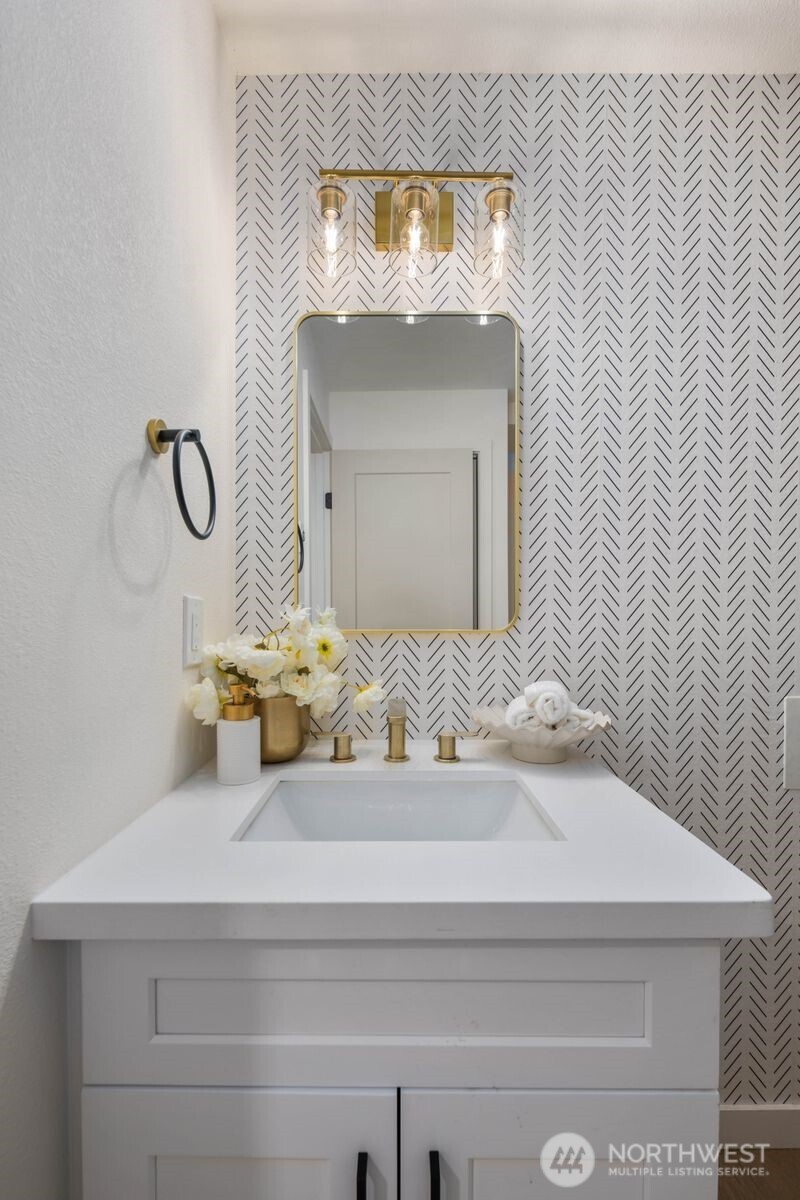 7211 182nd Street Southwest Edmonds, WA 98026 - Photo 36 of 40 a bathroom with a sink and a mirror