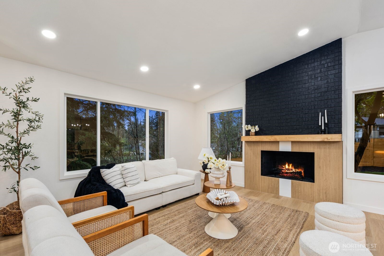 7211 182nd Street Southwest Edmonds, WA 98026 - Photo 8 of 40 a living room with furniture and a fireplace