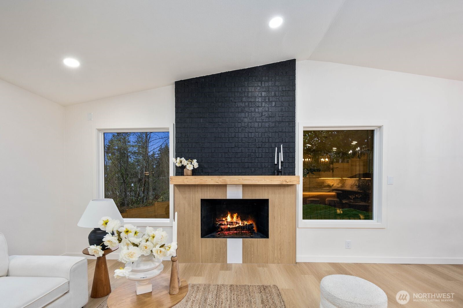 7211 182nd Street Southwest Edmonds, WA 98026 - Photo 10 of 40 a living room with furniture a window and a fireplace