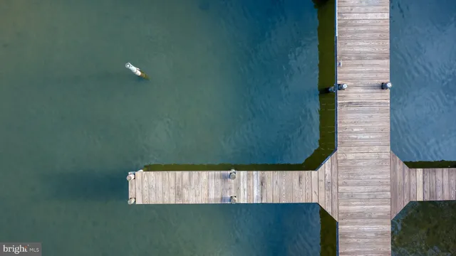 an aerial view of a house outdoor space and lake view