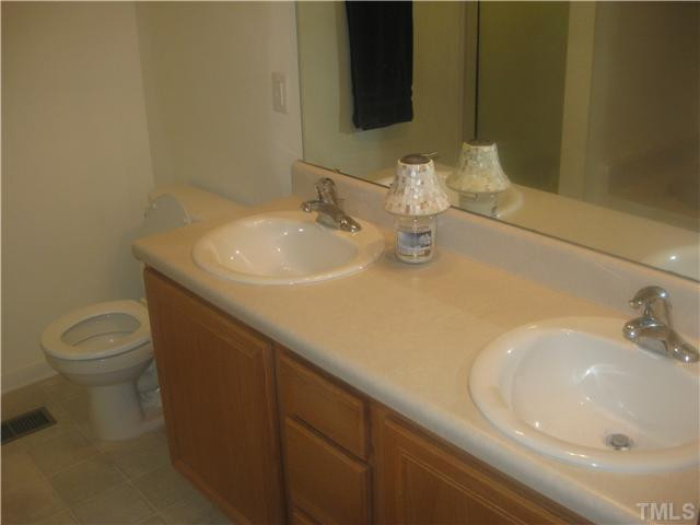 411 Hanson Road Durham, NC 27713 - Photo 7 of 16 Master bathroom with double vanity and garden tub Master Bath/Spa