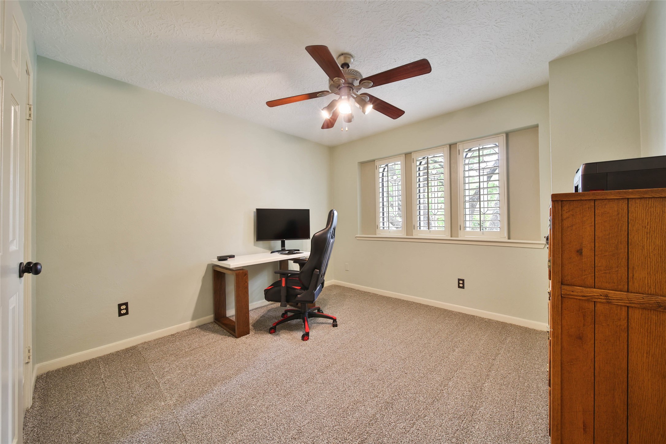 17007 Windrow Drive Spring, TX 77379 - Photo 35 of 46 a view of a workspace with furniture and a window