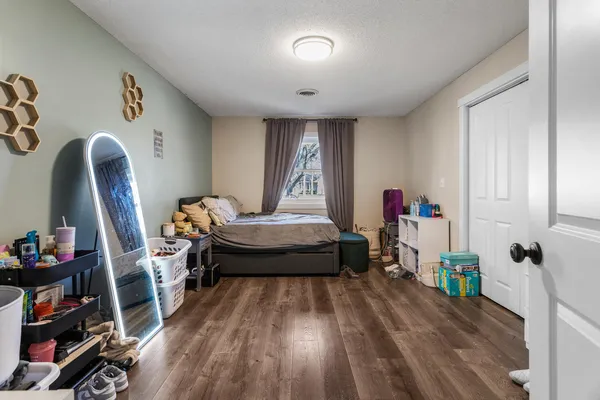 a bedroom with bed and a window