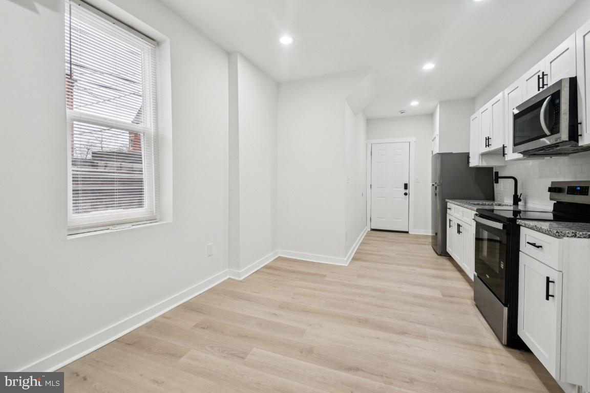 2330 Bryant Avenue Baltimore, MD 21217 - Photo 13 of 26 a view of a kitchen with microwave and cabinets