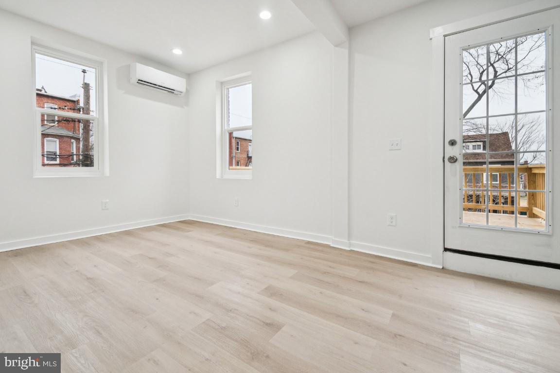 2330 Bryant Avenue Baltimore, MD 21217 - Photo 16 of 26 an empty room with windows and cabinet