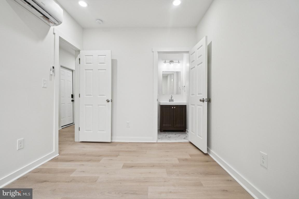 2330 Bryant Avenue Baltimore, MD 21217 - Photo 20 of 26 a view of empty room with wooden floor
