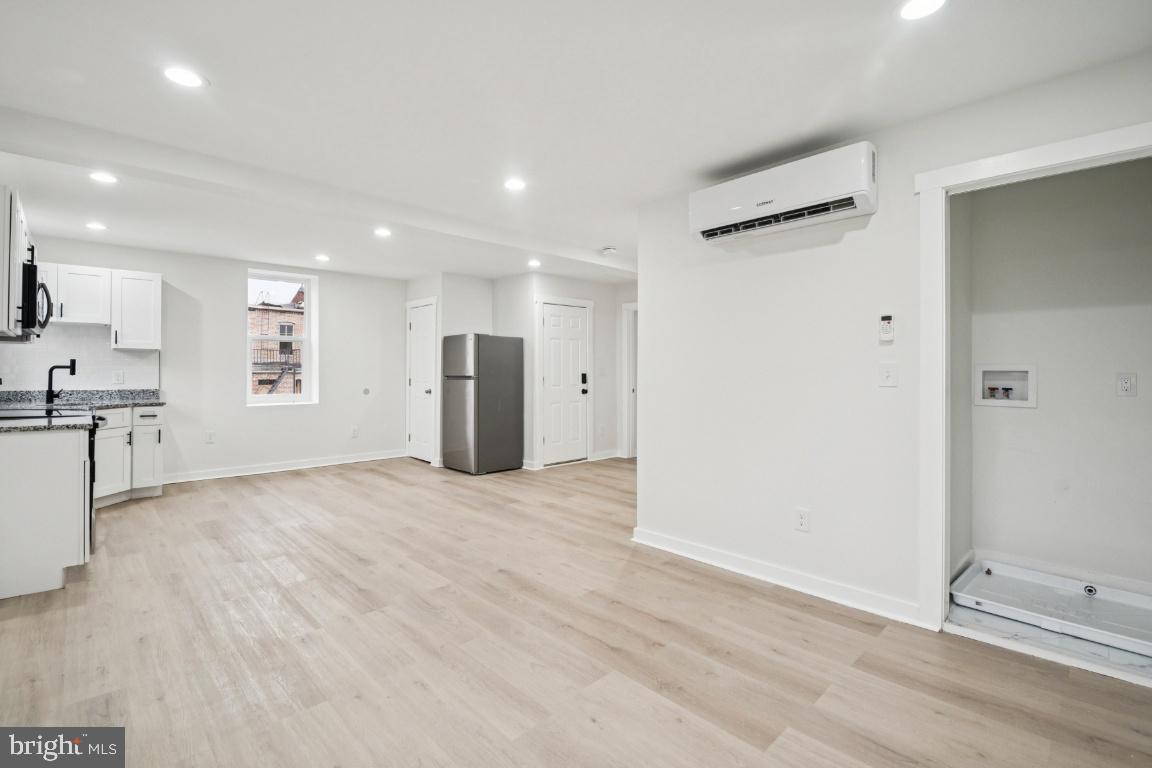 2330 Bryant Avenue Baltimore, MD 21217 - Photo 3 of 26 a view of an empty room with a window