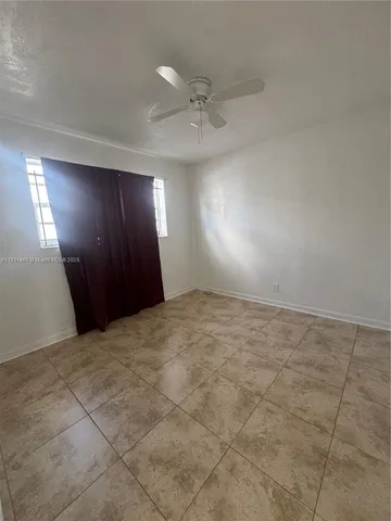 an empty room with a bathroom