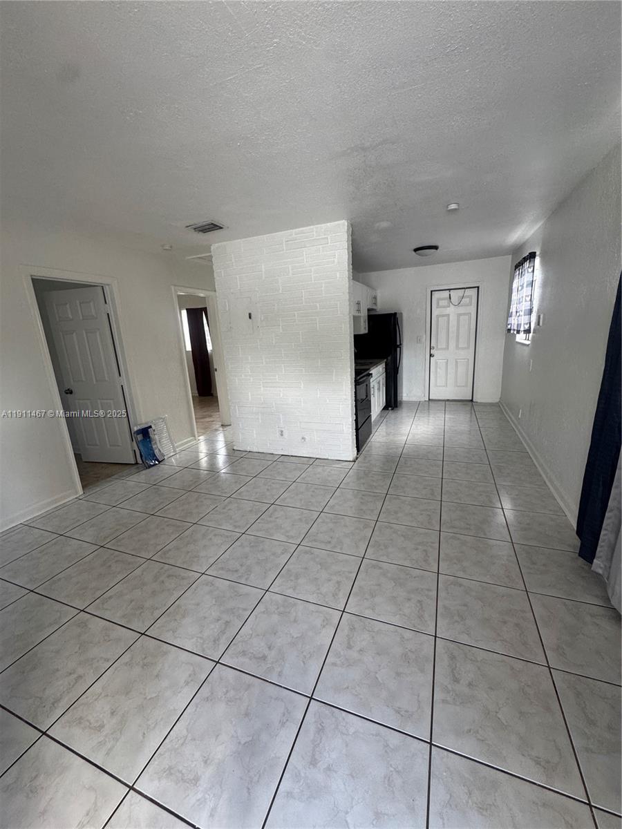 733 Northwest 4th Street, Unit 2 Hallandale Beach, FL 33009 - Photo 9 of 9 a view of a livingroom with a fireplace