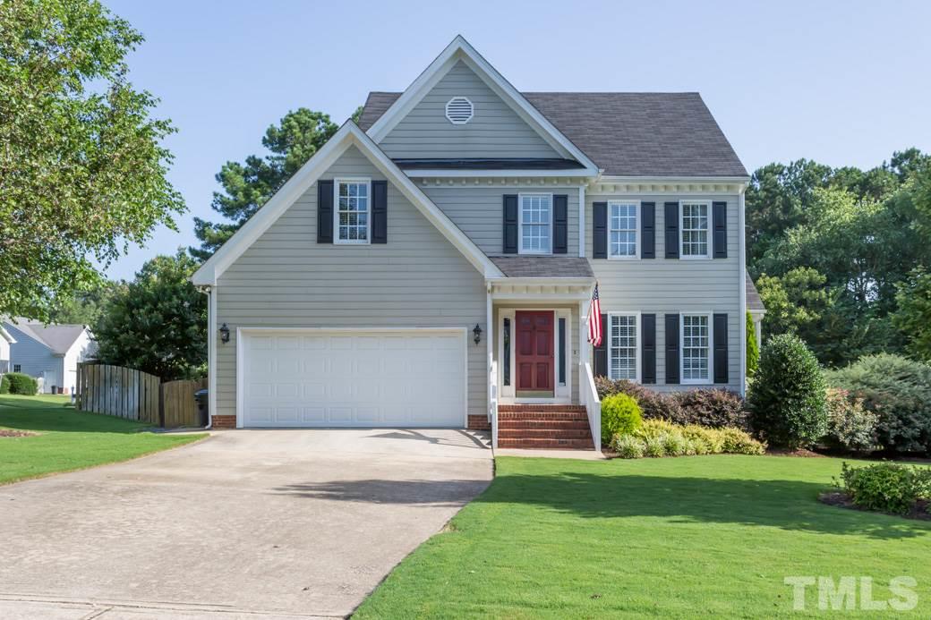 9232 Dawnshire Road Raleigh, NC 27615 - Photo 1 of 9 a front view of house with yard and green space