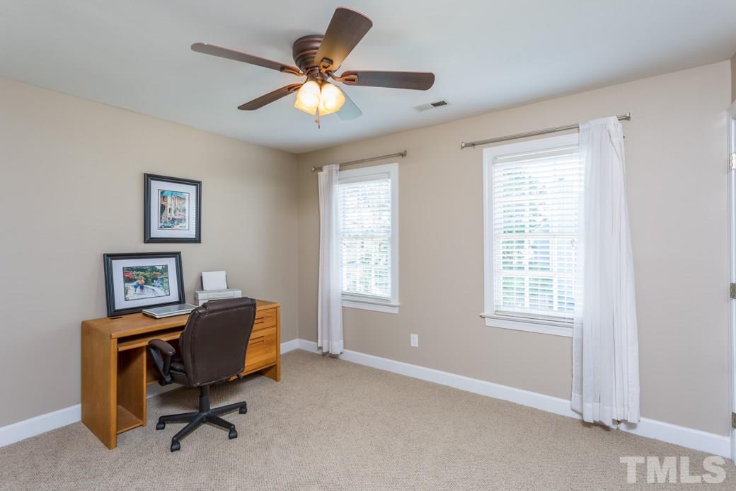 9232 Dawnshire Road Raleigh, NC 27615 - Photo 5 of 9 a view of a workspace with furniture and a window