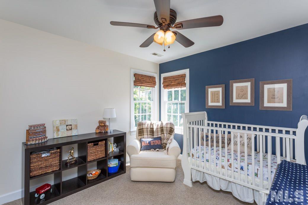 9232 Dawnshire Road Raleigh, NC 27615 - Photo 6 of 9 a bedroom with furniture and a window