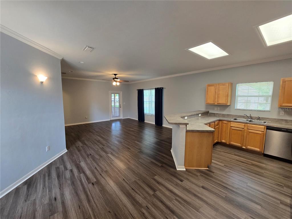 7976 48 Way Gainesville, FL 32653 - Photo 3 of 26 a view of kitchen with granite countertop window and wooden floors