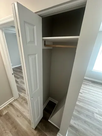 a view of an empty walk in closet