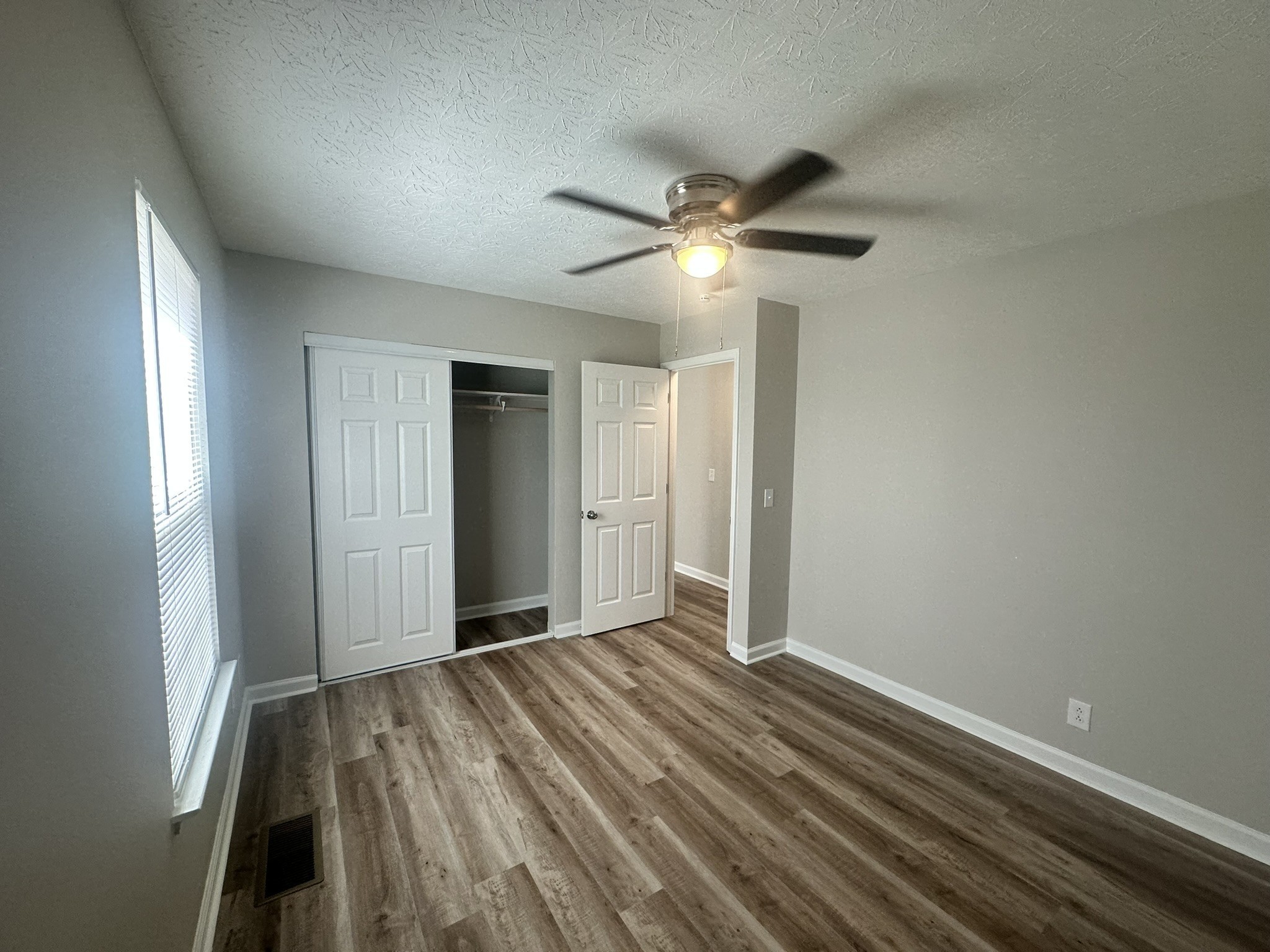 1506 Batts Boulevard, Unit 7 Springfield, TN 37172 - Photo 14 of 18 wooden floor in an empty room with a window