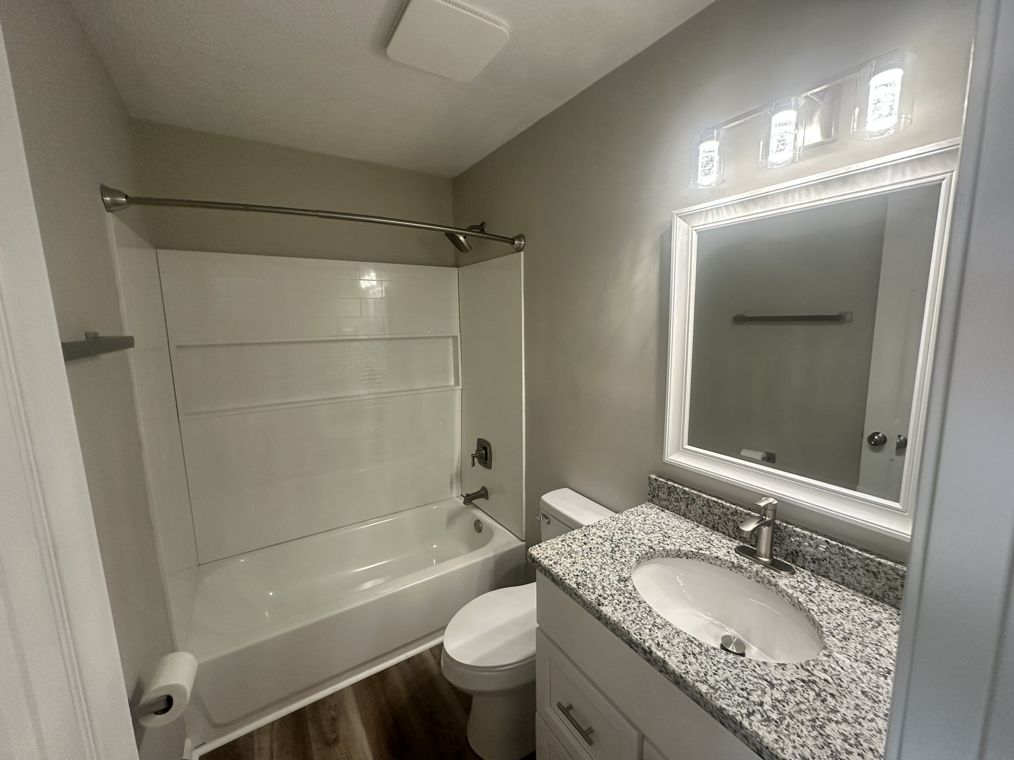 1506 Batts Boulevard, Unit 7 Springfield, TN 37172 - Photo 9 of 18 a bathroom with a granite countertop sink toilet and shower