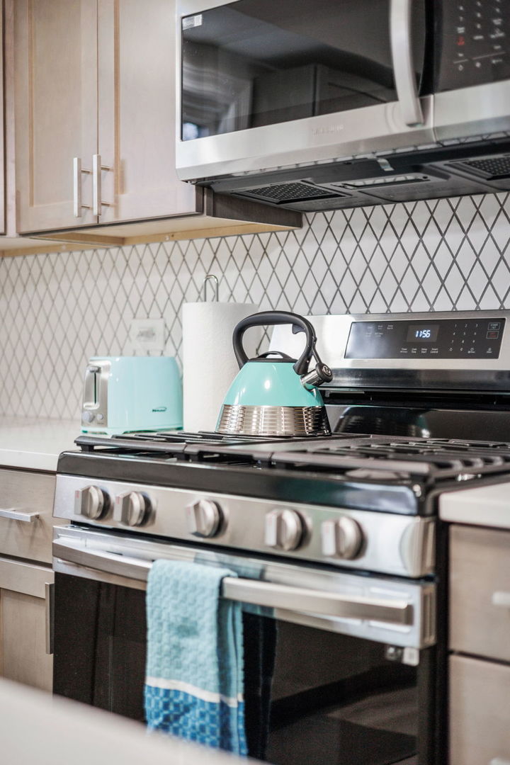 10907 South Normandy Avenue Worth, IL 60482 - Photo 11 of 29 a stove top oven sitting inside of a kitchen