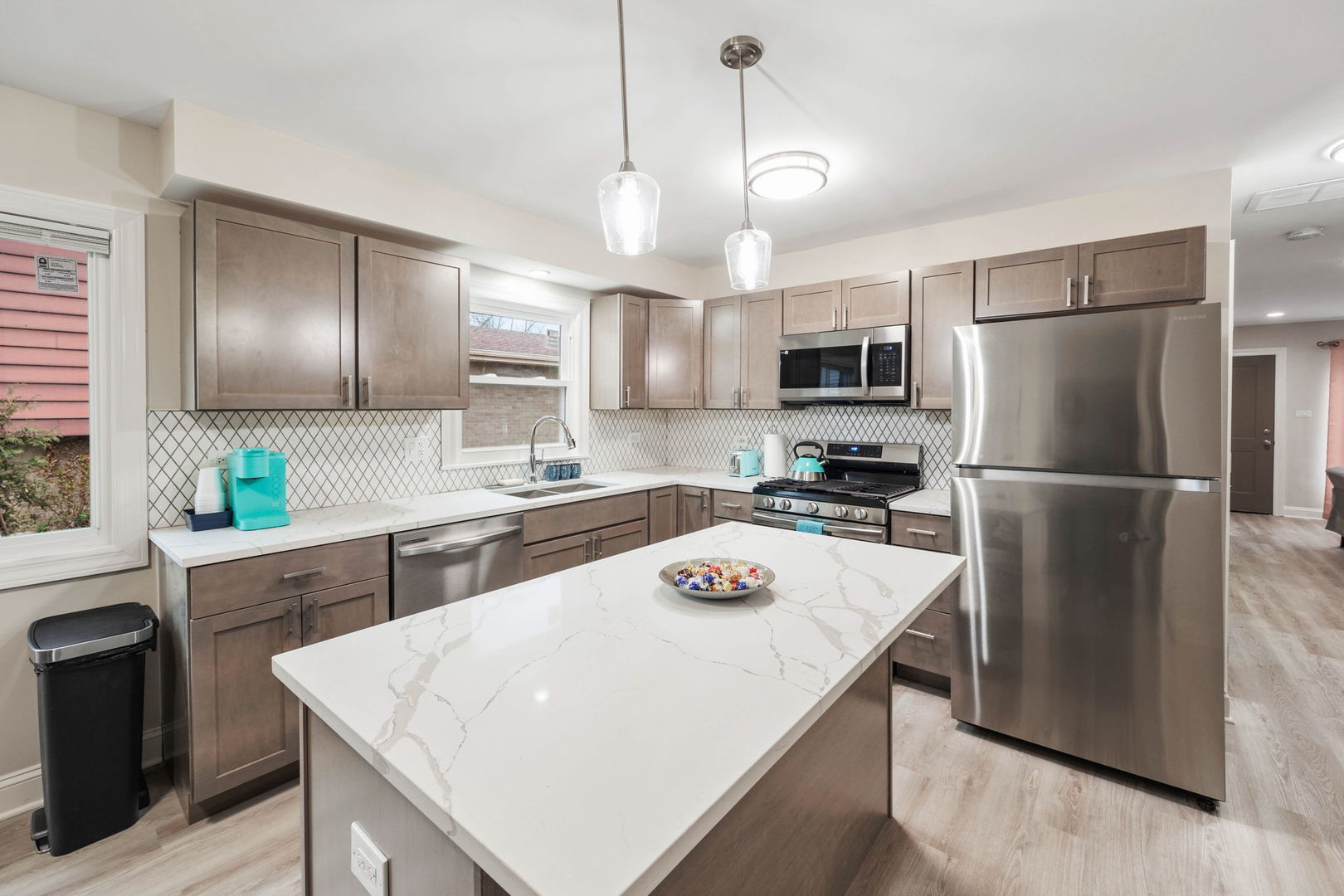 10907 South Normandy Avenue Worth, IL 60482 - Photo 12 of 29 a kitchen with refrigerator cabinets and wooden floor