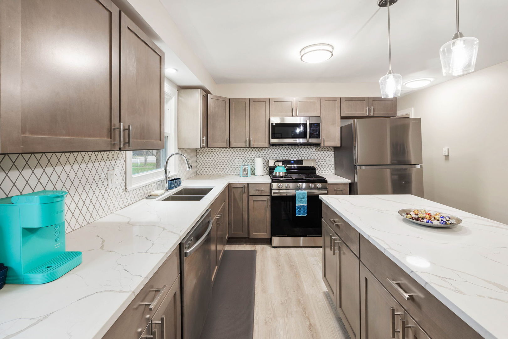 10907 South Normandy Avenue Worth, IL 60482 - Photo 17 of 29 a kitchen with kitchen island a white counter top space stainless steel appliances and cabinets