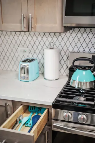 a view of a dining room with furniture and a potted plant