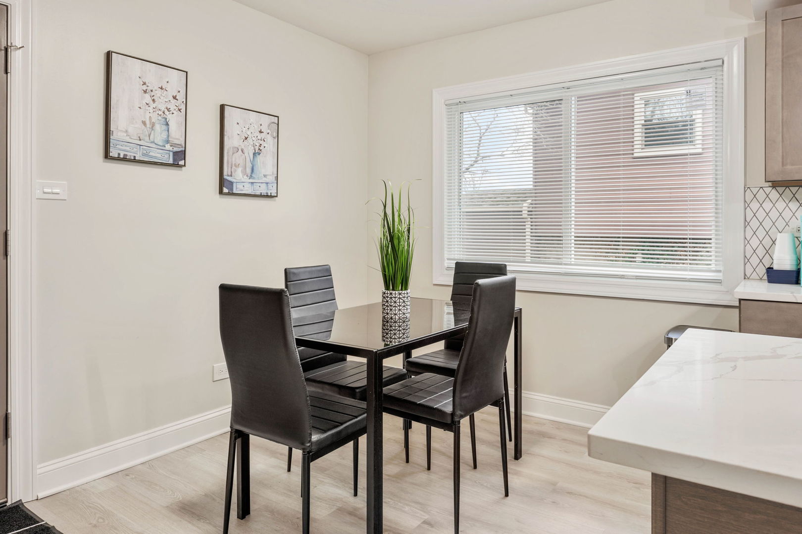 10907 South Normandy Avenue Worth, IL 60482 - Photo 20 of 29 a view of a dining room with furniture and a potted plant