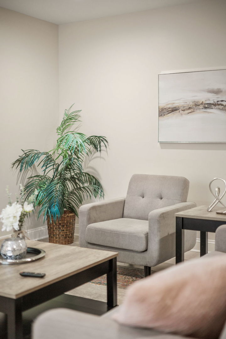 10907 South Normandy Avenue Worth, IL 60482 - Photo 6 of 29 a living room with furniture and a potted plant