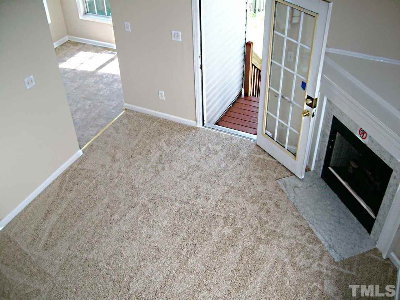 4717 Windbreak Lane Raleigh, NC 27616 - Photo 8 of 16 a view of an empty room and fire place