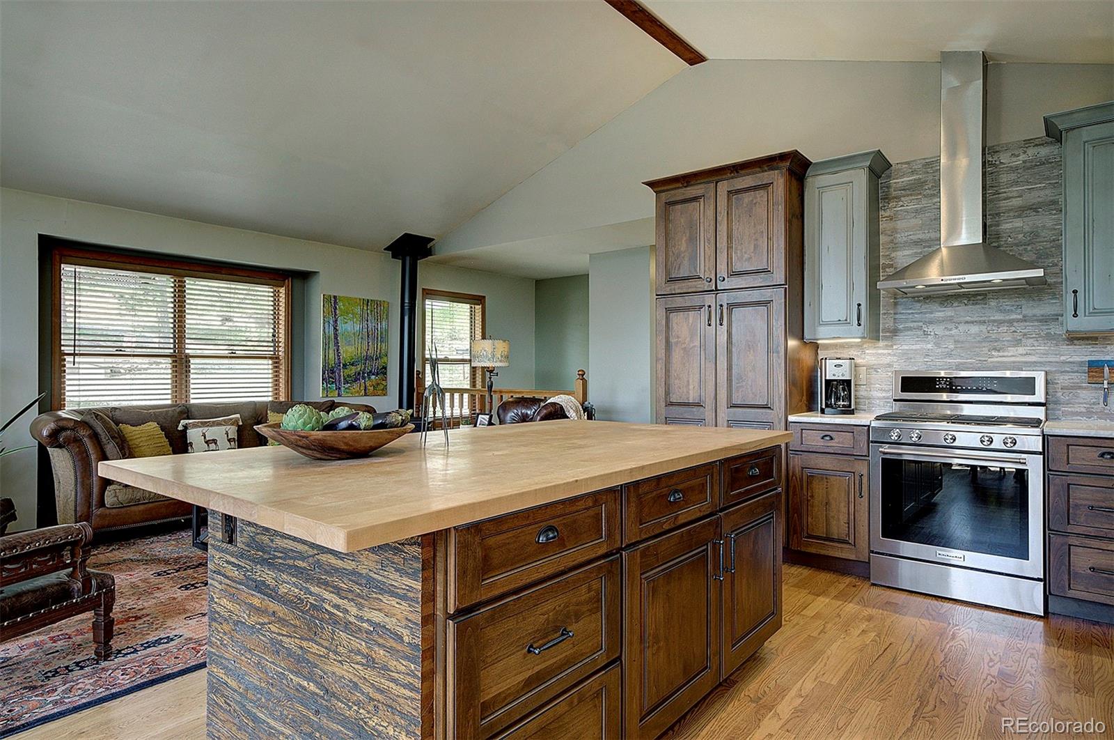 29659 Spruce Road Evergreen, CO 80439 - Photo 13 of 38 a kitchen with a stove and a sink