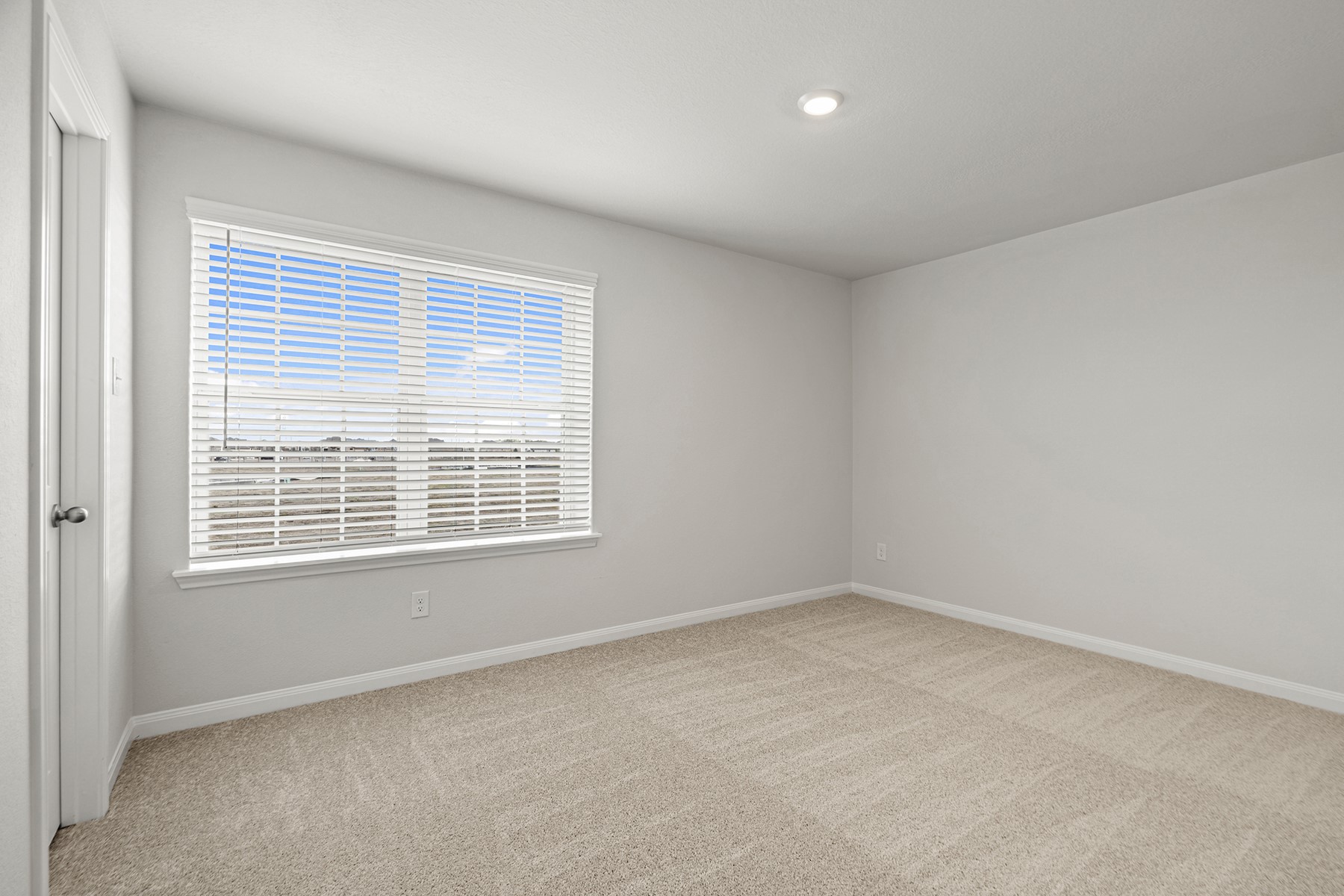 8830 Ice Quartz Drive Iowa Colony, TX 77583 - Photo 8 of 18 a view of an empty room with a window