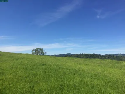 a view of a lake and sunset