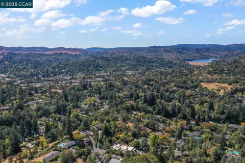 an aerial view of residential house and green space
