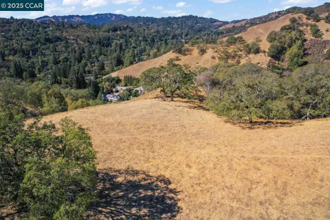 a view of a yard with a mountain