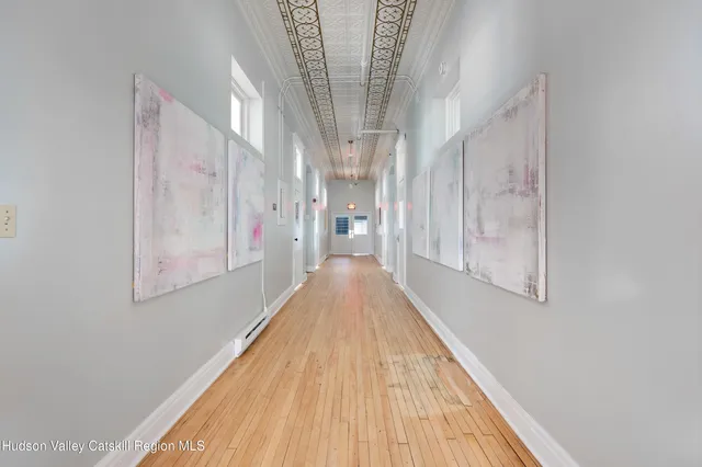 a view of a hallway with a large window