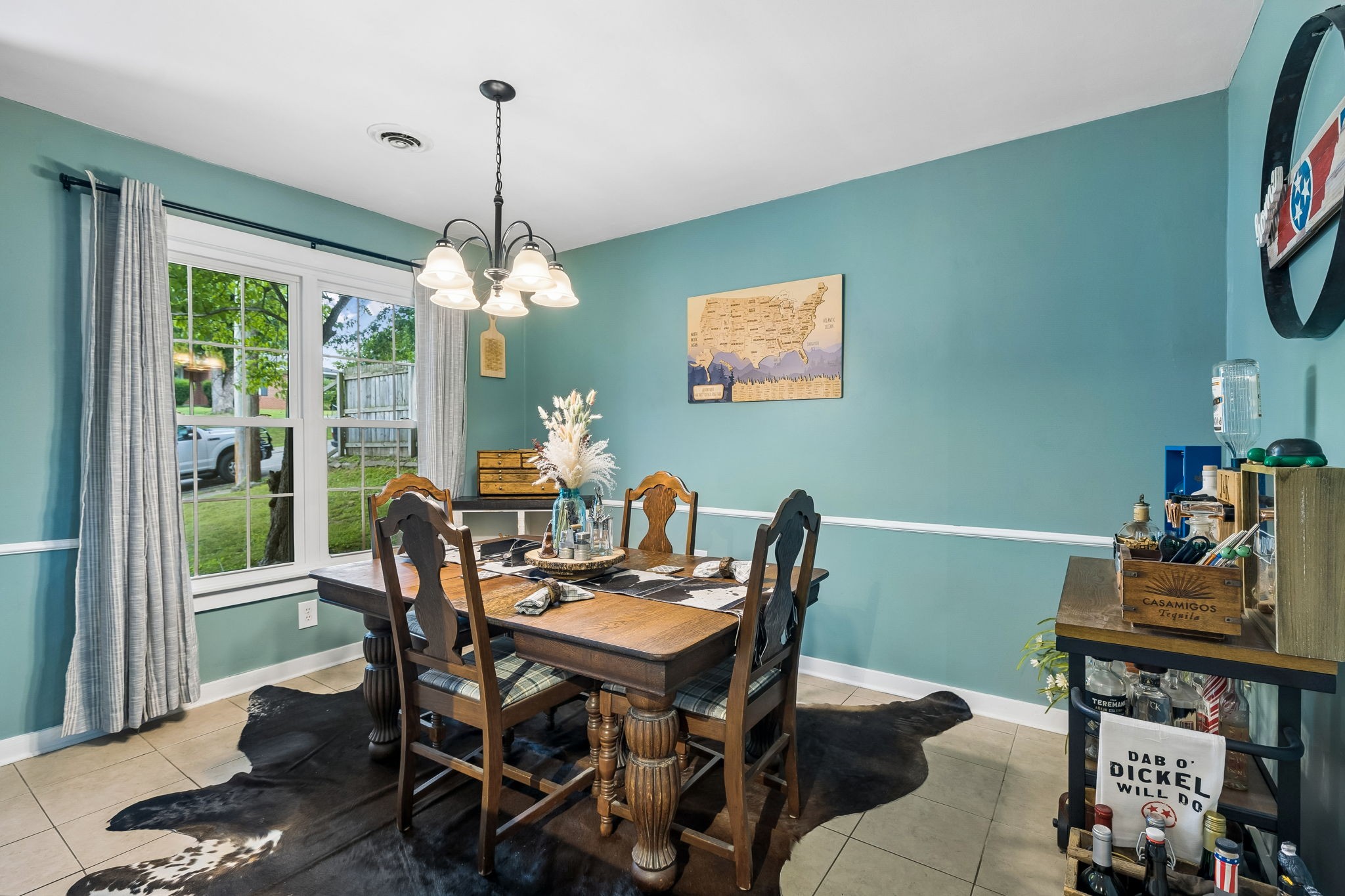 313 Cullum Street Carthage, TN 37030 - Photo 12 of 60 a dining room with furniture a rug and a chandelier