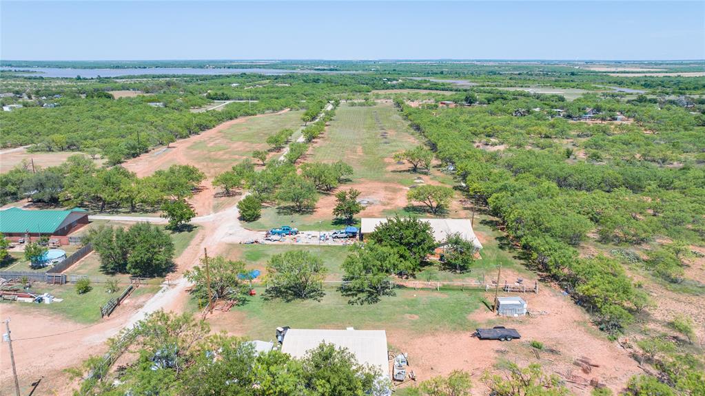 6702 West Lake Road Abilene, TX 79601 - Photo 19 of 21 a view of a lake with a yard
