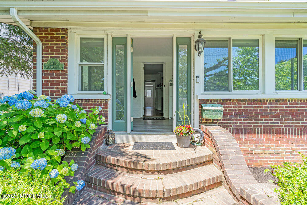 208 East Bergen Place Red Bank, NJ 07701 - Photo 1 of 25 a view of a house with a porch