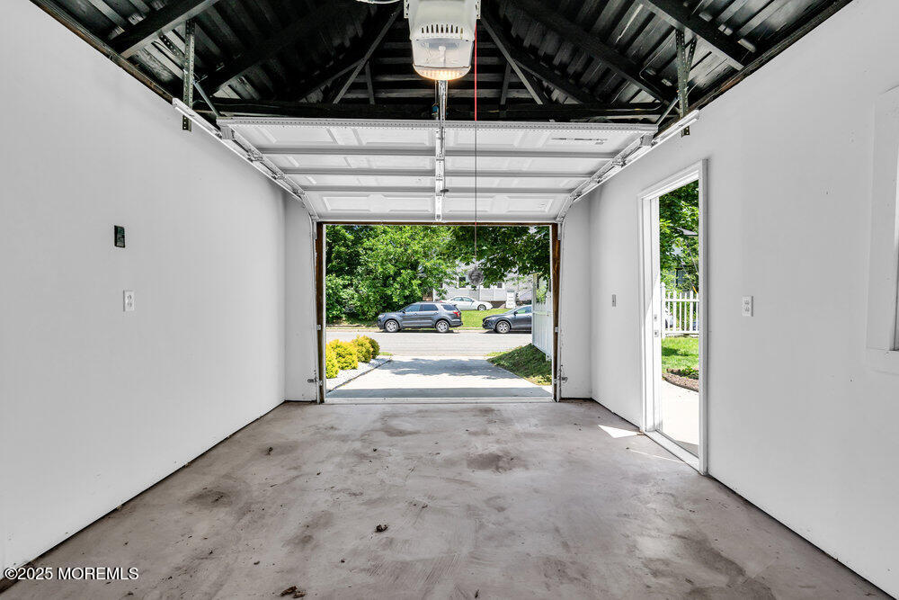 208 East Bergen Place Red Bank, NJ 07701 - Photo 21 of 25 a view of empty room with wooden floor and fan