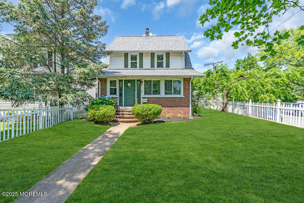 208 East Bergen Place Red Bank, NJ 07701 - Photo 23 of 25 a front view of a house with a yard
