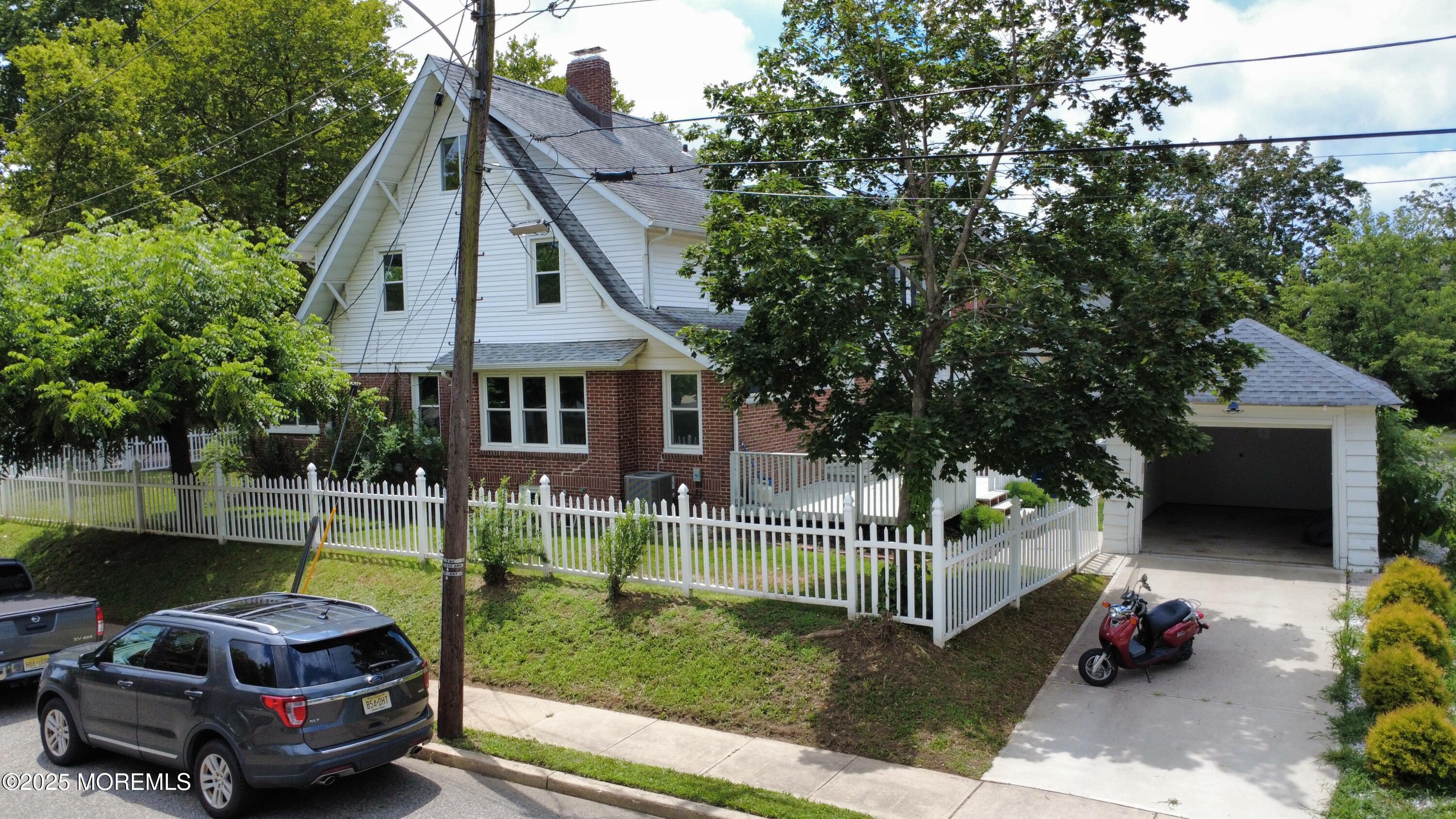 208 East Bergen Place Red Bank, NJ 07701 - Photo 24 of 25 a house view with a garden space