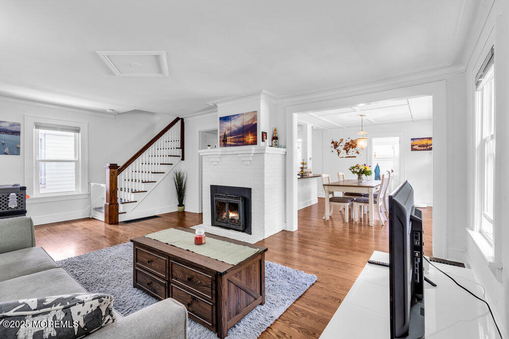 208 East Bergen Place Red Bank, NJ 07701 - Photo 5 of 25 a living room with furniture and a fireplace