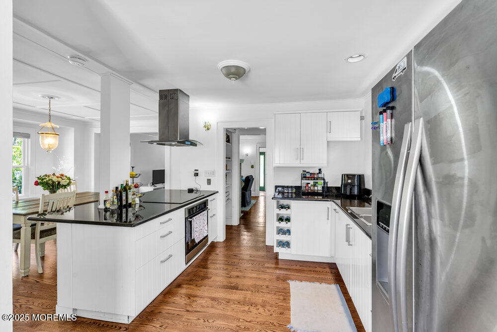 208 East Bergen Place Red Bank, NJ 07701 - Photo 6 of 25 a kitchen with stainless steel appliances a sink stove refrigerator and cabinets