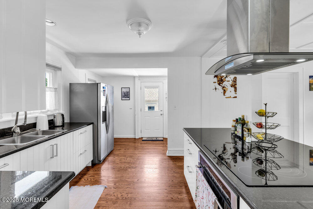 208 East Bergen Place Red Bank, NJ 07701 - Photo 7 of 25 a kitchen with stainless steel appliances a sink stove and cabinets