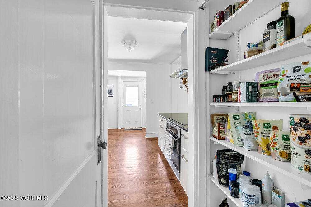 208 East Bergen Place Red Bank, NJ 07701 - Photo 9 of 25 a hallway with wine glasses in front of it